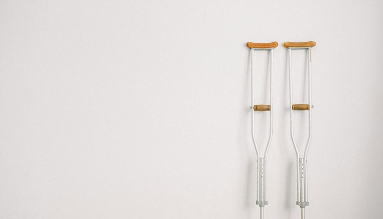 Crutches leaning against a wall